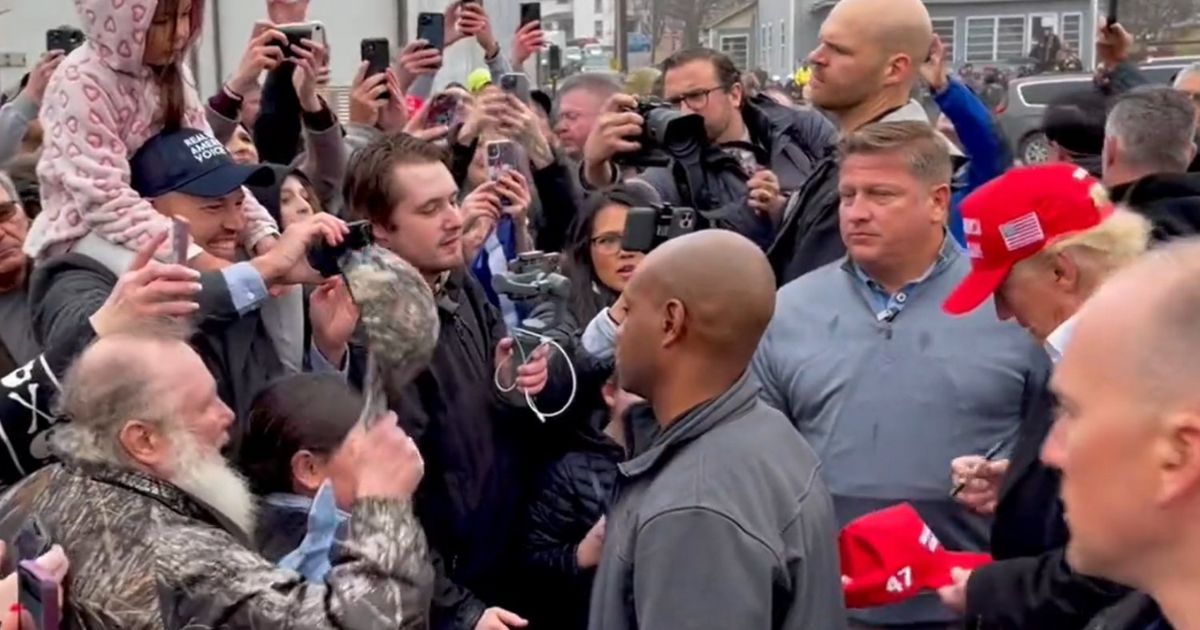 Viewers quickly spotted the new detail on the right of the MAGA hats Trump was signing.