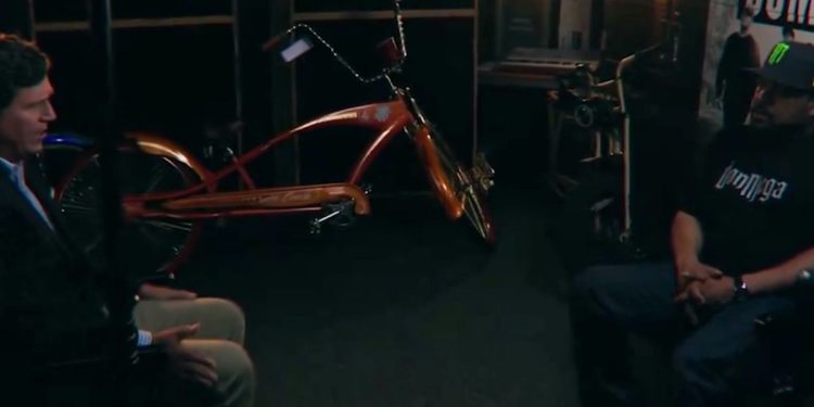 On Tucker Carlson's Wednesday episode of "Tucker on Twitter," the conservative, left, sits with rapper and actor Ice Cube, right, to discuss his thoughts on race and police.