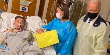 Sgt. Tyler Vargas-Andrews, left, is a Marine who survived an explosion in Kabul, Afghanistan, in August 2021. President Joe Biden, right, visited Vargas-Andrews at the hospital, but the visit did not go over well.