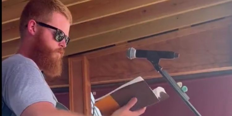 Viral country music sensation Oliver Anthony took the time to open his free concert on Sunday by reading from the Bible.
