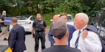 Former Vice President Mike Pence turns to confront a heckler on Friday in Londonderry, New Hampshire.