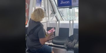 An attendant on board an automated shuttle bus in Orlando, Florida, just before the shuttle bus made contact with another city bus.