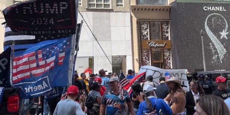 Supporters of former President Donald Trump rally Sunday outside the Trump Tower in New York City.