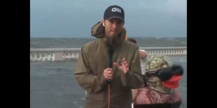 CNN meteorologist Derek Van Dam was interrupted by a strange object floating down the streets of Tampa, Florida, on Wednesday.