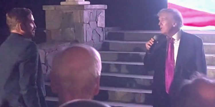 Former President Donald Trump, right, congratulates actor Jim Caviezel, left, after a screening of "Sound of Freedom."