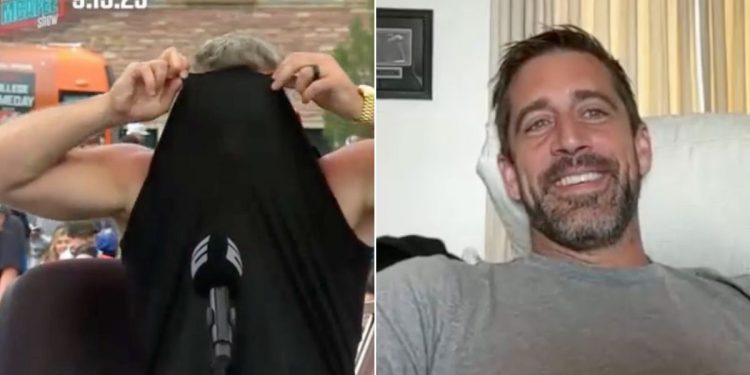 ESPN host and former NFL punter Pat McAfee, left, responded to a quip by Aaron Rodgers, right, by hiding his face inside his shirt.