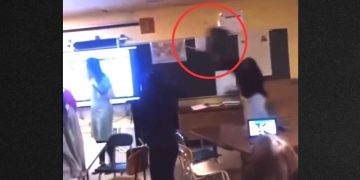 Video appears to show a screaming student throwing a chair, which hit the teacher in the head, knocking her unconscious.