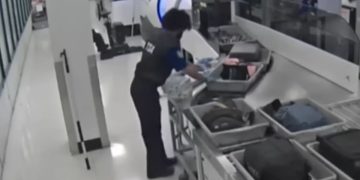 Investigators said the agents conspired to distract passengers while cash was stolen from their belongings.