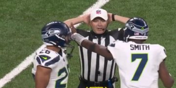 A referee is seen in an exchange with a player on Sunday.