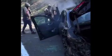 Thieves robbed a driver on a Los Angeles freeway on Tuesday after intentionally crashing into his car.