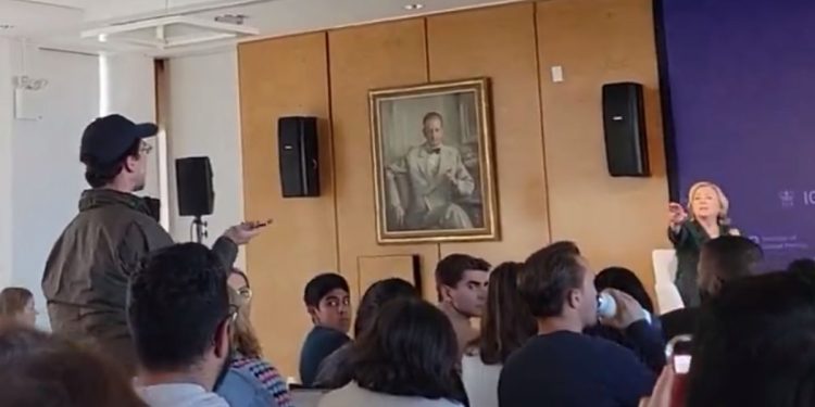 A man heckles Hillary Clinton during an event at Columbia University in New York City.