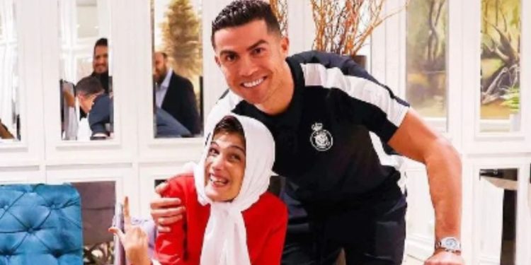 Soccer star Christiano Ronaldo, right, embraced Iranian artist Fatemeh Hamami, while meeting with fans.