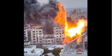The Palestine Tower, a building that includes apartment a media offices in the Gaza Strip, is destroyed in an Israeli bombing Saturday.