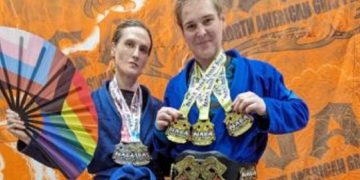 Cordelia Gregory, left, and Corissa Griffith, men identifying as women, post with their medals at the Georgia Grappling & BJJ Championship in October in Marietta, Georgia.
