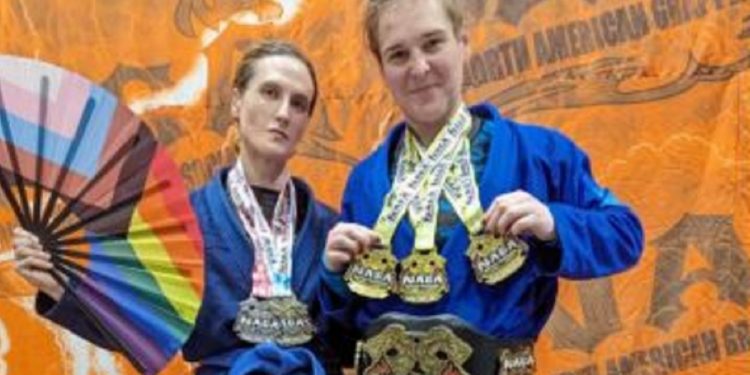 Cordelia Gregory, left, and Corissa Griffith, men identifying as women, post with their medals at the Georgia Grappling & BJJ Championship in October in Marietta, Georgia.