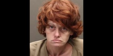 This YouTube screen shot shows the mug shot of Rebecca Auborn, who has been accused of a number of crimes.