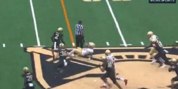 A referee remains on his feet after knocking down Boston College quarterback Thomas Castellanos on Saturday.