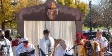 A woman reads from the Torah during a Rabbis for Ceasefire event in Washington on Nov. 13.