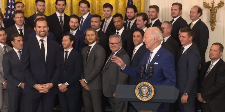 President Joe Biden talks to some clearly puzzled players for the Vegas Golden Knights NHL hockey team at the White House on Monday.