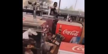 An Israeli man pictured walking through the concession area of a music festival attacked by Hamas terrorists on Oct. 7 in southern Israel.