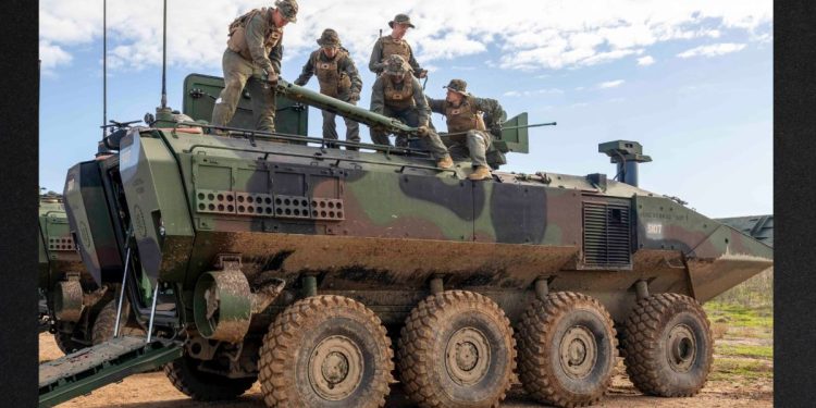Marines at Camp Pendleton are seen in a Nov. 29 photo on an amphibious combat vehicle similar to the one involved in a fatal accident Tuesday.