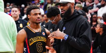 Lebron James Slammed for Sitting Down During National Anthem at Son’s Game