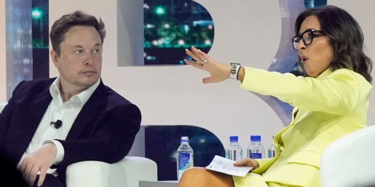 Linda Yaccarino, right, CEO of social media platform X, backed up Elon Musk's controversial statements this week about advertisers he said were attempting to "blackmail" him by pulling their ads.