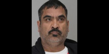 This is the mugshot of Jose Santiago Chairez, who stands accused of murdering two sisters and shooting his daughter.