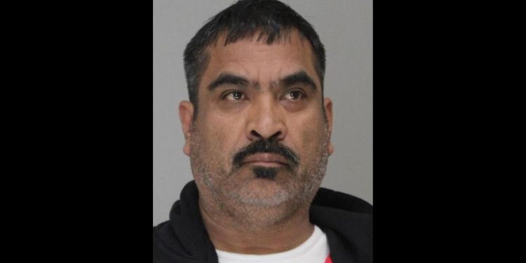 This is the mugshot of Jose Santiago Chairez, who stands accused of murdering two sisters and shooting his daughter.