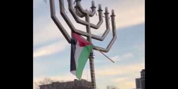 A Palestinian flag is seen on top of a menorah at Yale University.