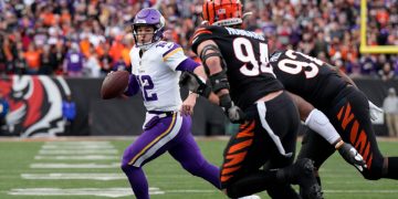 Minnesota Vikings quarterback Nick Mullens scrambles with the ball in the fourth quarter of Saturday's game against the Cincinnati Bengals at Paycor Stadium in Cincinnati. Mullens gave up a costly interception earlier in the game.