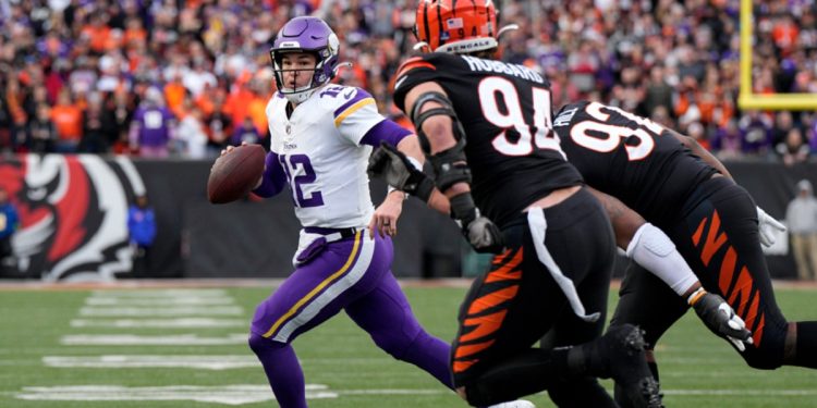 Minnesota Vikings quarterback Nick Mullens scrambles with the ball in the fourth quarter of Saturday's game against the Cincinnati Bengals at Paycor Stadium in Cincinnati. Mullens gave up a costly interception earlier in the game.