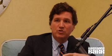 Former Fox News host Tucker Carlson is pictured from in interview on a podcast hosted by actress and comedian Roseanne Barr.