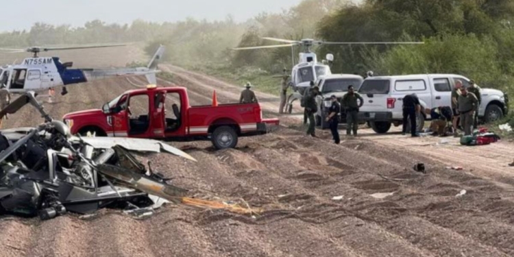 Officials respond to the site of Friday's National Guard helicopter crash near La Grulla, Texas.
