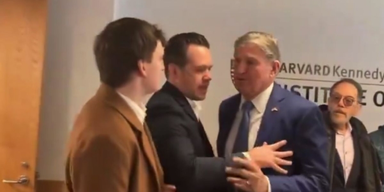 a protester confronting Joe Manchin