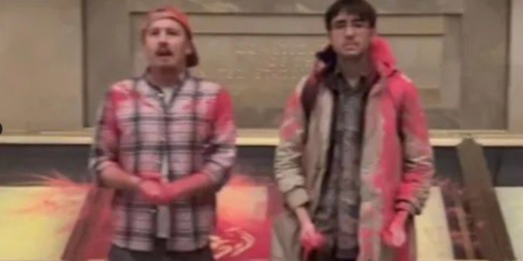 The two were charged with felony destruction of government property, according to the Department of Justice.