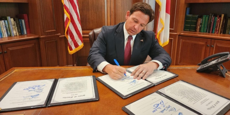 This X screen shot shows Republican Florida Gov. Ron DeSantis signing various bills into law on May 15, 2024.